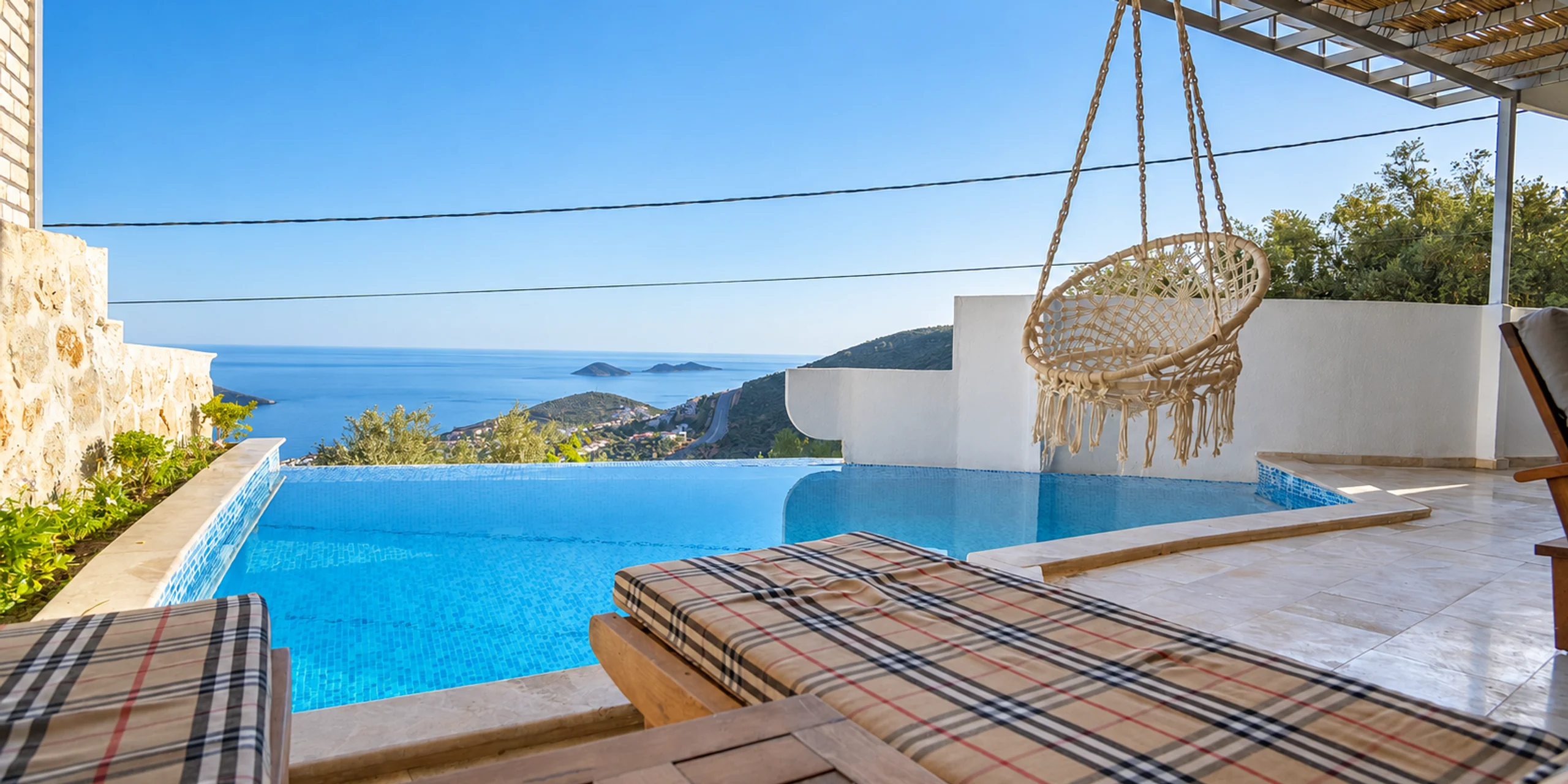 Villa Kapsül's sea-view pool and hanging chair
